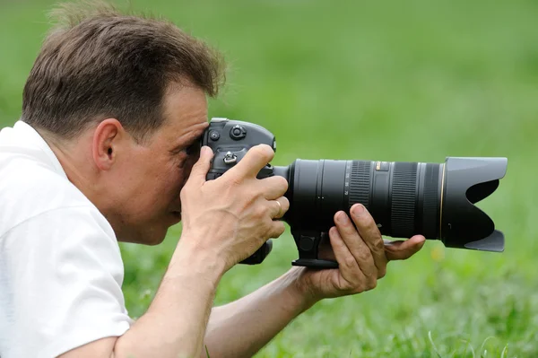 Photographer taking photo in wild