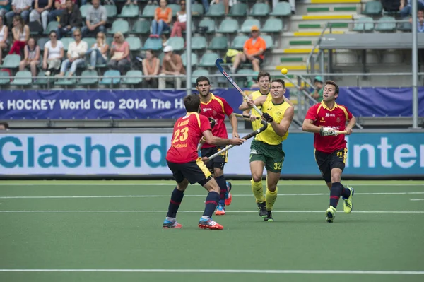 Australia beats Spain during the World Cup Hockey 2014