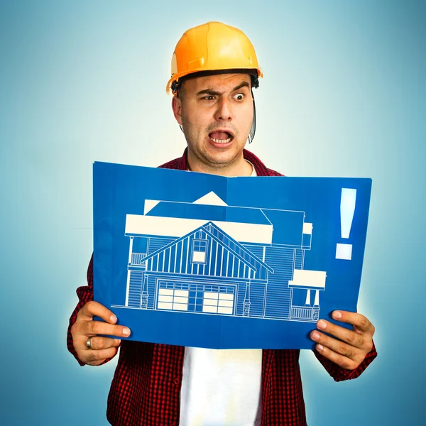 Construction worker with blueprint