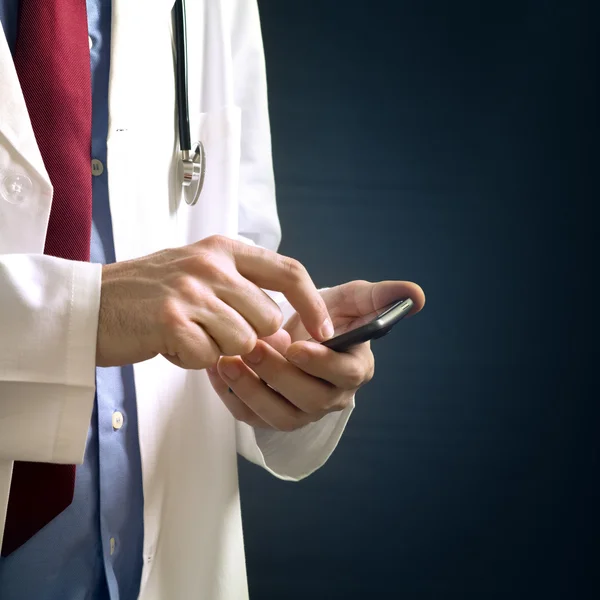 Doctor using smartphone device