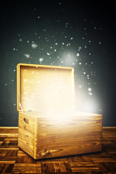Open magical Wooden crate box on the floor