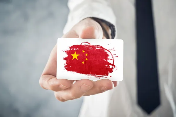 Chinese Businessman holding business card with China Flag