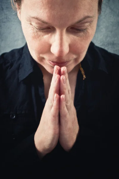 Woman praying and praising the God