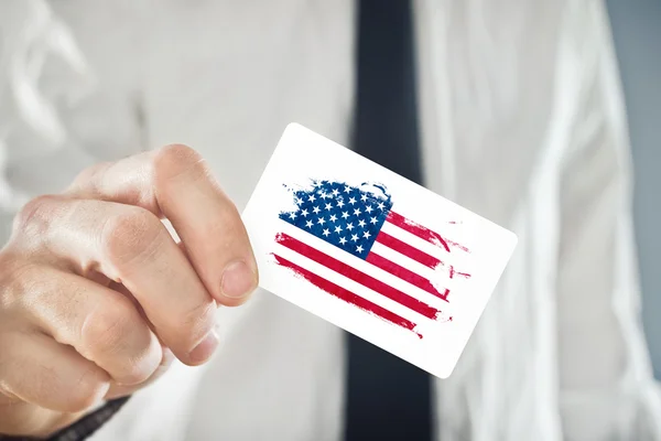 American Businessman holding business card with USA Flag
