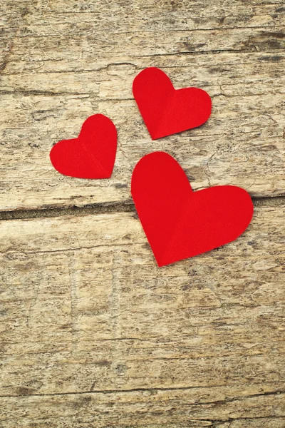 Paper hearts on wood background