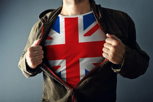 Man stretching jacket to reveal shirt with great Britain flag