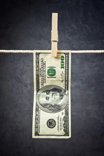 American Dollars hanging on rope