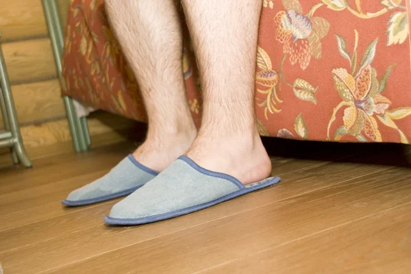 Man\'s legs in slippers