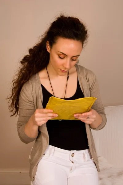 Young woman reading post