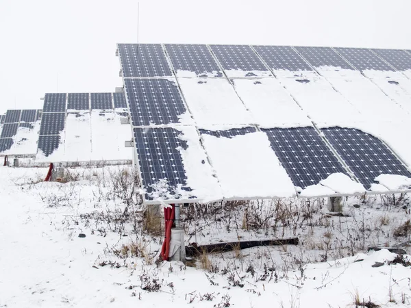 Solar panels covered with snow