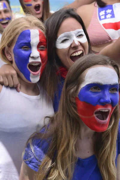 Group of happy USA soccer fans commemorating victory.