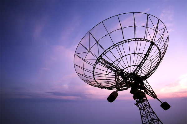 Satellite dishes with sunset