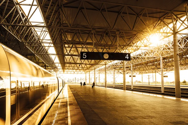 Train stop at railway station with sunlight