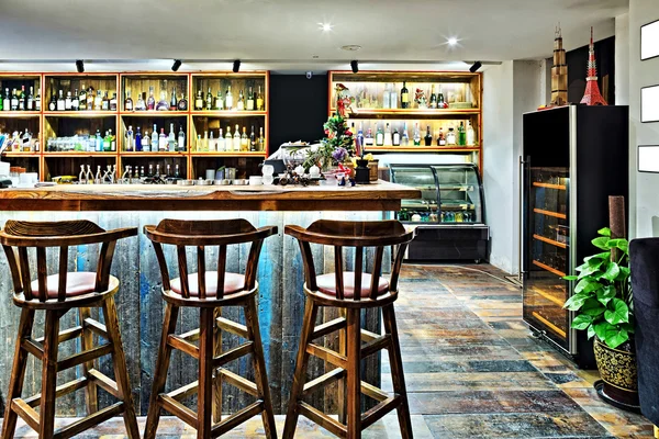 Bar counter with chairs in empty comfortable restaurant