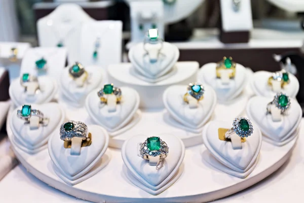 Rings with precious stones in the gold market