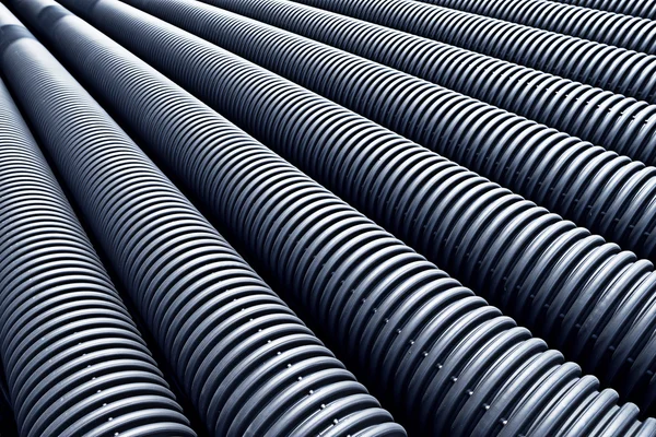 Black plastic pipes with diminishing perspective