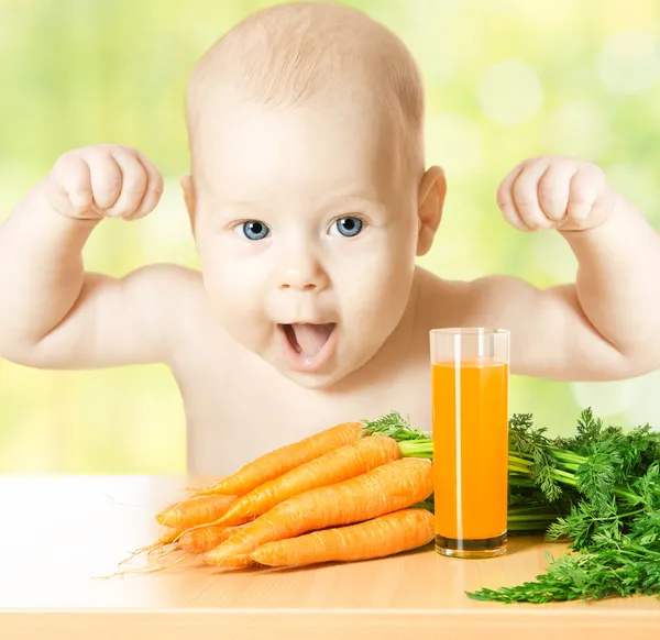 Child and fresh carrot juice glass. healthy baby food