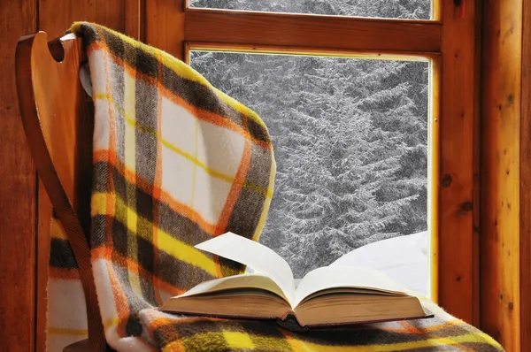 Book on a chair in winter
