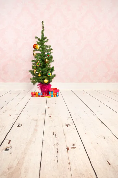 Vintage wall and wooden floor with Christmas tree