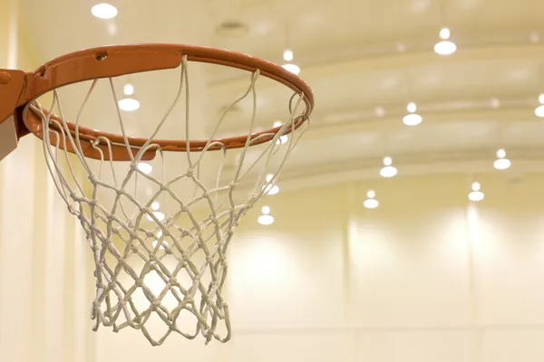 Scoring basket in basketball court