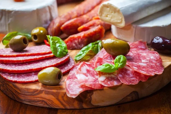 Salami catering platter with different meat and cheese products
