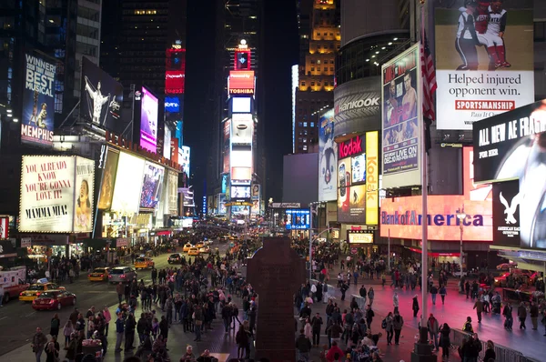 Pedestrians gather in Times Square