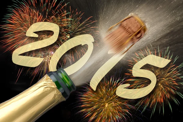 Popping Champagne and firework for new year 2015