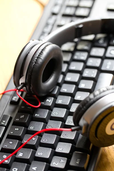 Headphones with keyboard — Stock Photo #34068287