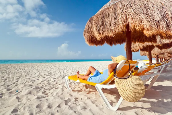 Relaxation under parasol at Caribbean Sea