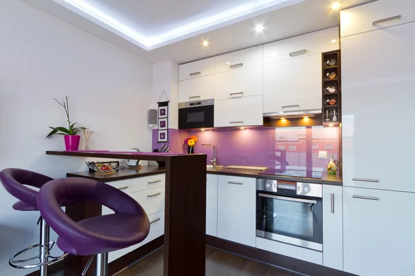 White and purple kitchen interior