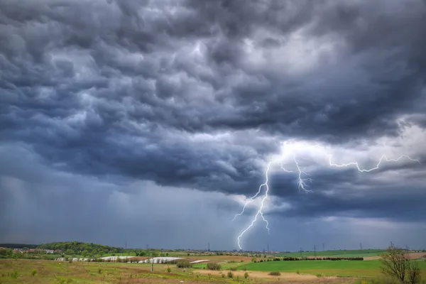 Summer thunderstorm over the meadow