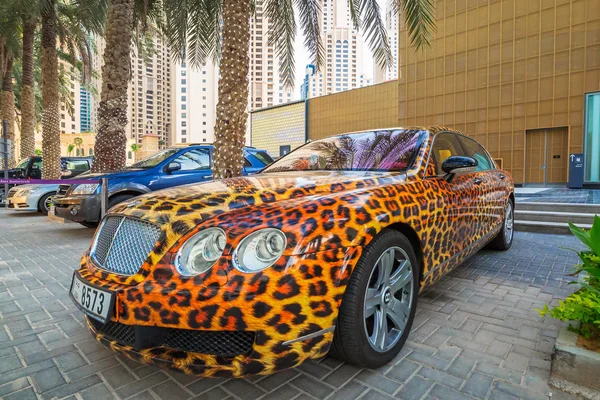 Panther paint Bentley parked outside the Hilton Dubai Hotel