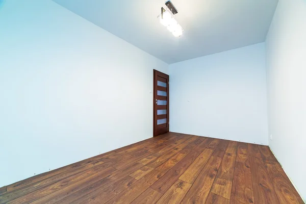 Empty apartment interior with wooden floor
