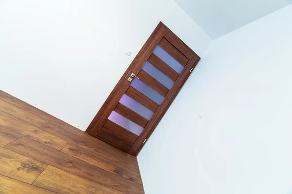 Empty apartment interior with wooden floor