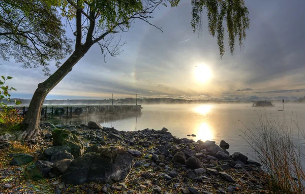 Beautiful autumn scenery of Swedish lake in the morning