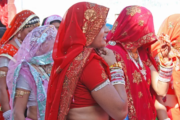 Colorful Indian women form a wedding procession