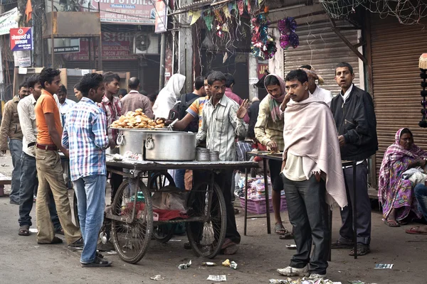 Man cooking and selling India's street food