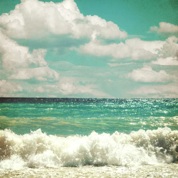 Sea with waves and clouds sky - picture in retro style