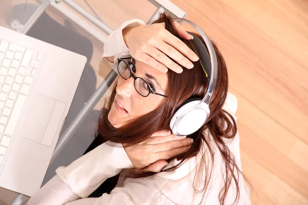 Woman with a Laptop and Headphones