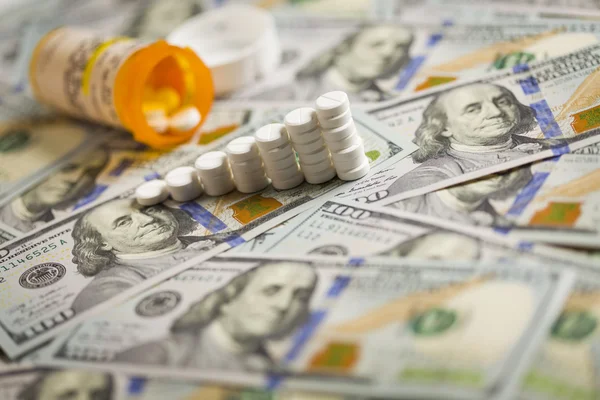 Medicine Pills Stacked on Newly Designed One Hundred Dollar Bill