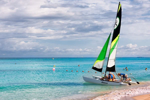 Family of tourists going sailing in the cuban beach of Varadero