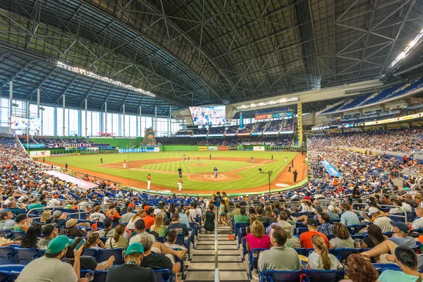 Fans watching a baseball game at the Miami Marlins Stadium