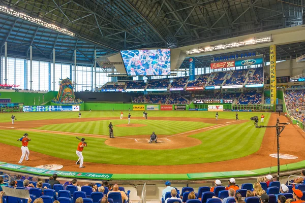 Fans watching a baseball game at the Miami Marlins Stadium