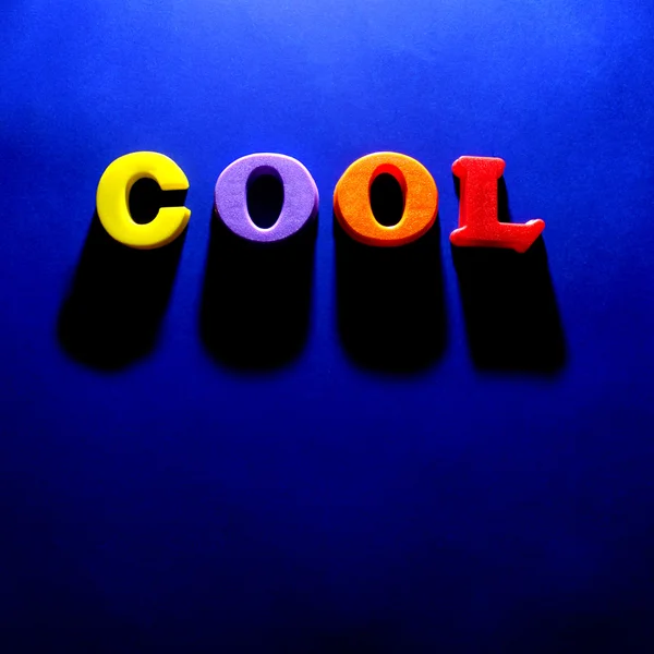 The Word Cool on Blue Background
