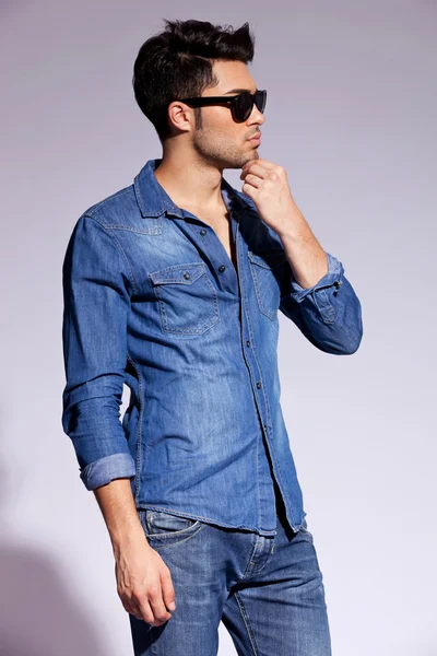 Handsome young male model wearing jeans shirt