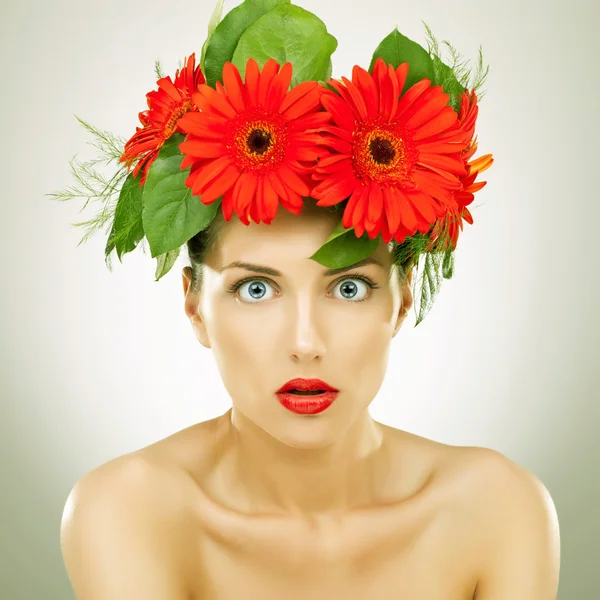 Amazed with red gerbera flowers on her head