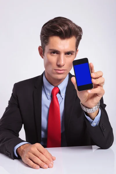 Business man shows phone