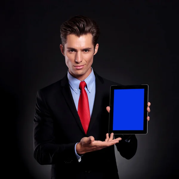 Business man presents tablet