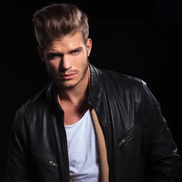 Young fashion man in leather jacket