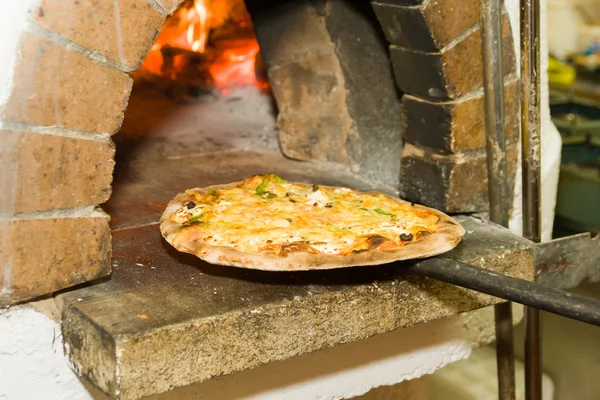 Pizza baking in the oven